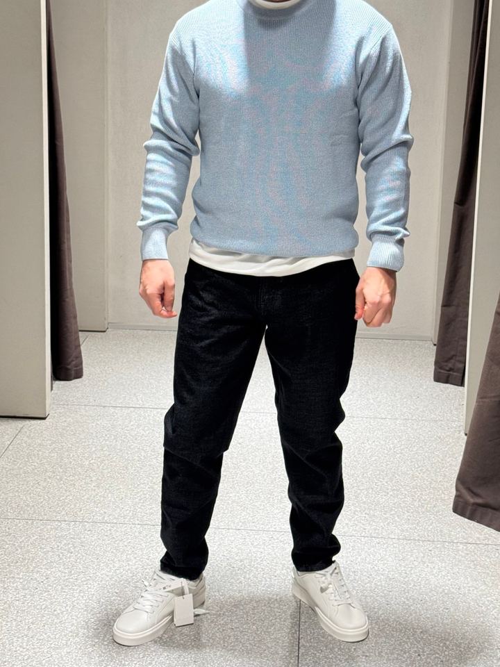 The same light blue sweater with dark jeans